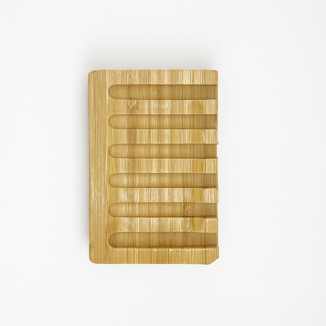 The Green Llama Bamboo Dish Soap Holder with Signature Branding, shown on a white background, features a rectangular shape, rounded edges, and a smooth natural finish for an eco-friendly touch.
